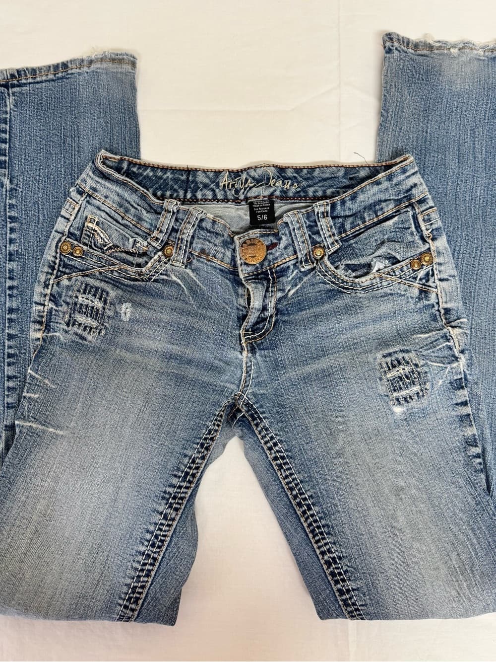 Ariya Light Wash Boot Cut Jeans with Distressed Detail