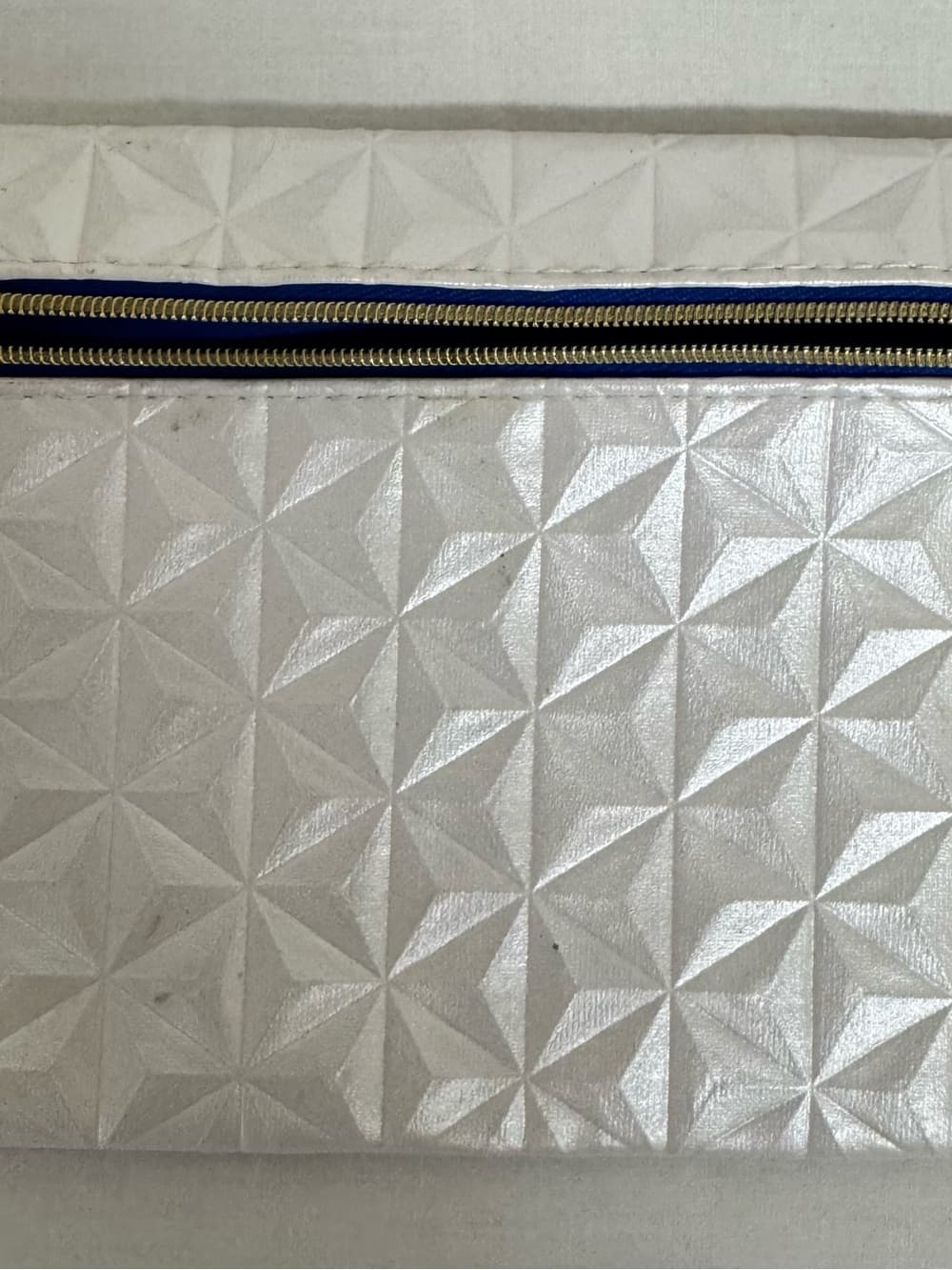 ipsy Silver Geometric Pouch with Gold Charm and Navy Trim